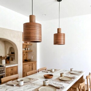 Wood pendant light made of walnut wood perfect for your kitchen or dining room. The right choice of modern chandelier will give your space the aura you desire
