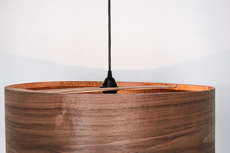 Wood pendant light made of walnut wood perfect for your bedroom or living room. The right choice of modern chandelier will give your space the aura you desire