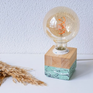 An Edison table lamp which highlights the natural beauty of each individual unique wood. Handmade wooden table lamps are one of interior decor favorites, as they add to the main lighting and add style to interior decoration.