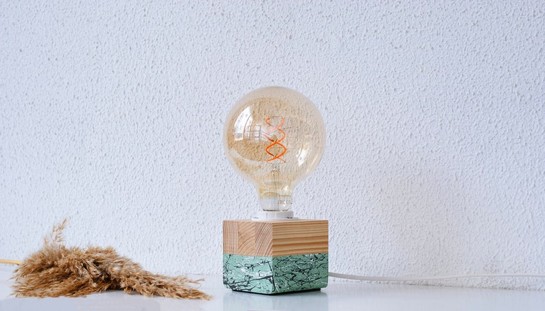 An Edison table lamp which highlights the natural beauty of each individual unique wood. Handmade wooden table lamps are one of interior decor favorites, as they add to the main lighting and add style to interior decoration.