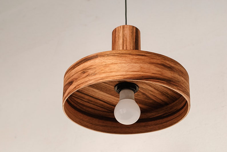 Modern ceiling light made of mango wood perfect for your kitchen or dining room. The right choice of wooden lampshade will give your space the aura you desire