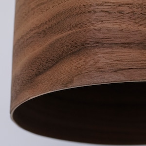 Wood pendant light made of walnut wood perfect for your kitchen or dining room. The right choice of modern chandelier will give your space the aura you desire