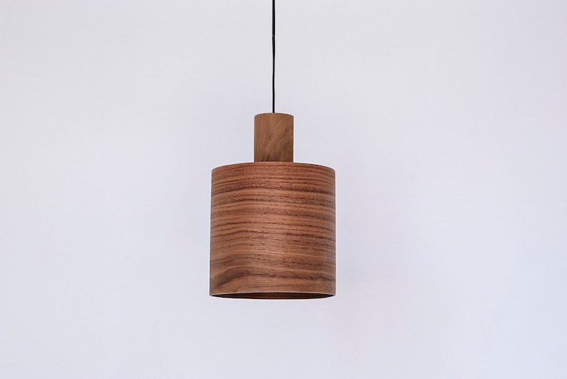 Wood pendant light made of walnut wood perfect for your kitchen or dining room. The right choice of modern chandelier will give your space the aura you desire
