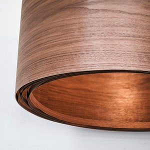 Wood light fixture made of walnut wood perfect for your bedroom or living room. The right choice of wooden pendant light will give your space the aura you desire