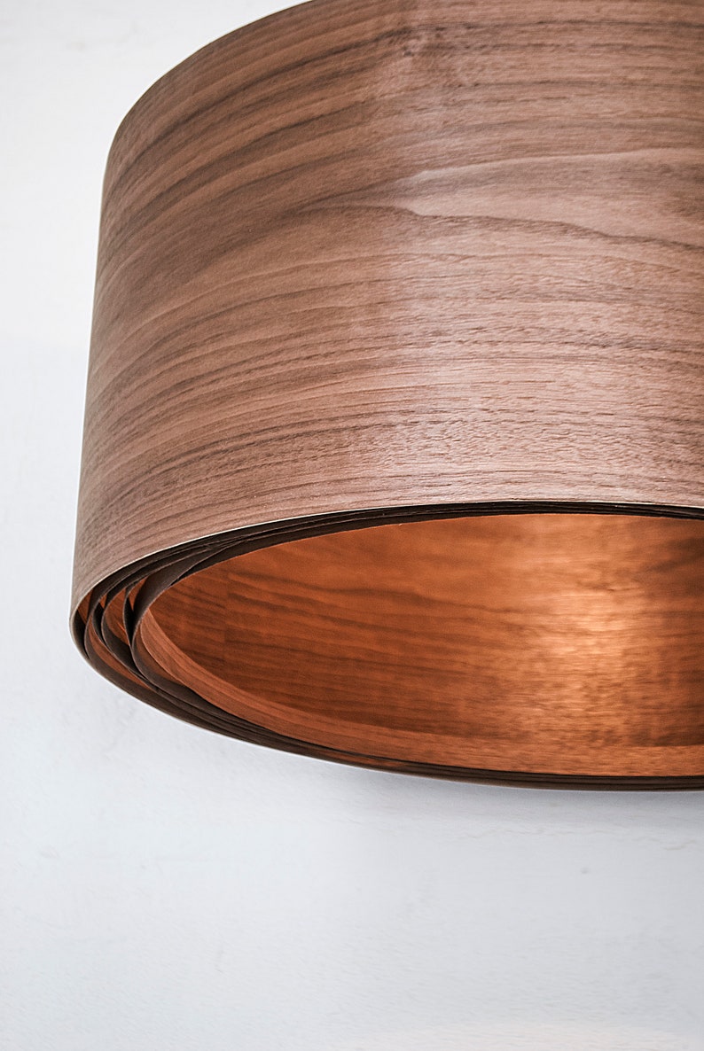 Wood light fixture made of walnut wood perfect for your bedroom or living room. The right choice of wooden pendant light will give your space the aura you desire