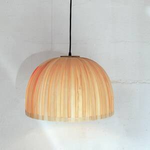 Minimal maple wood hanging lamp shade showing natural wood grain texture