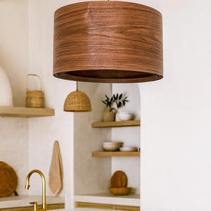 Wood pendant light made of walnut wood perfect for your bedroom or living room. The right choice of modern chandelier will give your space the aura you desire