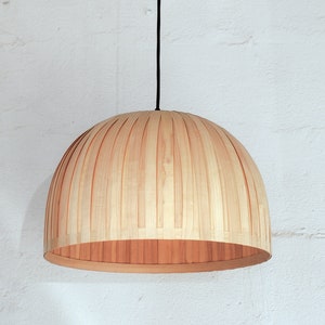 Minimal maple wood hanging lamp shade showing natural wood grain texture