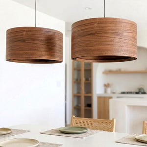 Wood pendant light made of walnut wood perfect for your dining room, kitchen island or living room. The right choice of modern chandelier will give your space the aura you desire