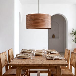 Wood pendant light made of walnut wood perfect for your dining room, kitchen island or living room. The right choice of modern chandelier will give your space the aura you desire