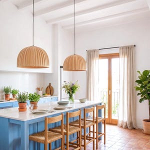 Maple wood pendant light Bell Maple Scandinavian ceiling lamp hanging above dining table with warm glow