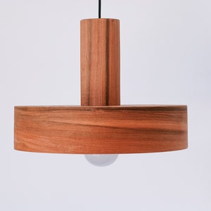 Wood pendant light made of apple chile wood perfect for your bedroom or living room. Ideal for spot light. The right choice of modern chandelier will give your space the aura you desire