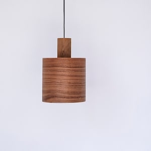 Wood pendant light made of walnut wood perfect for your kitchen or dining room. The right choice of modern chandelier will give your space the aura you desire