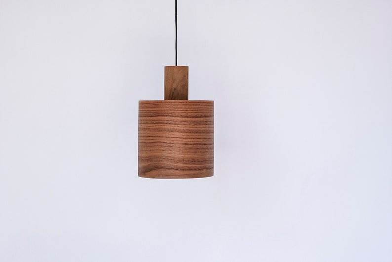 Wood pendant light made of walnut wood perfect for your kitchen or dining room. The right choice of modern chandelier will give your space the aura you desire