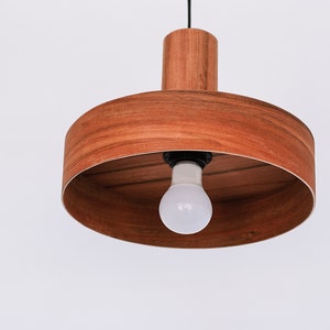 Modern ceiling light made of apple chile wood perfect for your kitchen or dining room. Ideal for spot light. The right choice of wooden lampshade will give your space the aura you desire