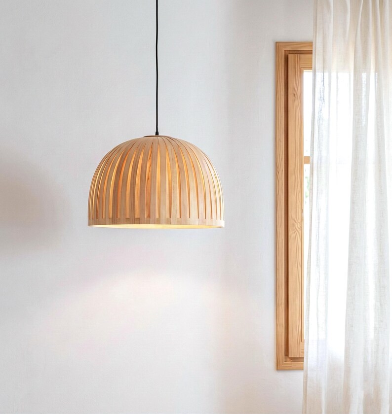 Warm light glowing through maple veneer pendant lamp creating cozy ambient lighting