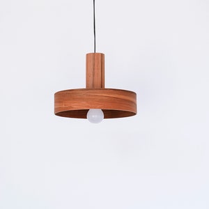 Wood pendant light made of apple chile wood perfect for your bedroom or living room. Ideal for spot light. The right choice of modern chandelier will give your space the aura you desire