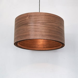 Wood light fixture made of walnut wood perfect for your bedroom or living room. The right choice of wooden pendant light will give your space the aura you desire