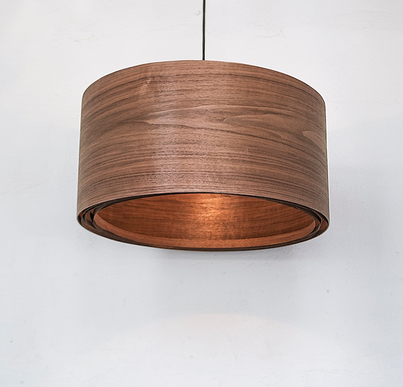 Wood light fixture made of walnut wood perfect for your bedroom or living room. The right choice of wooden pendant light will give your space the aura you desire