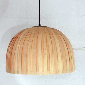 Minimal maple wood hanging lamp shade showing natural wood grain texture