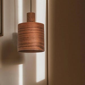 Wood pendant light made of walnut wood perfect for your kitchen or dining room. The right choice of modern chandelier will give your space the aura you desire