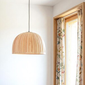 Minimal maple wood hanging lamp shade showing natural wood grain texture