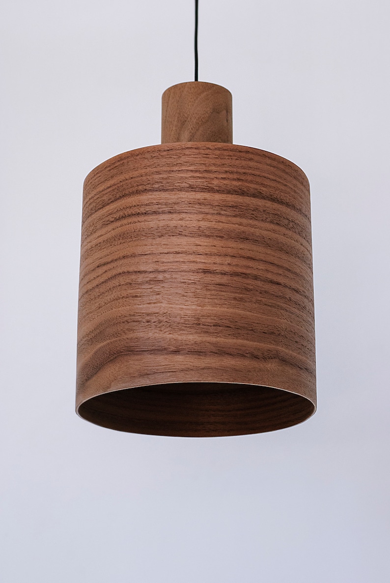 Wood pendant light made of walnut wood perfect for your kitchen or dining room. The right choice of modern chandelier will give your space the aura you desire