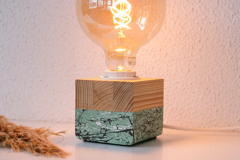 An Edison table lamp which highlights the natural beauty of each individual unique wood. Handmade wooden table lamps are one of interior decor favorites, as they add to the main lighting and add style to interior decoration.