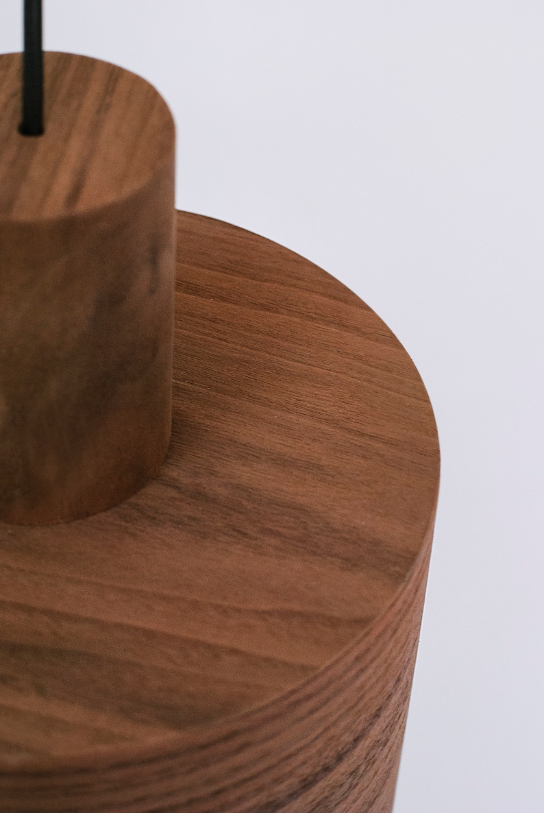 Wood pendant light made of walnut wood perfect for your kitchen or dining room. The right choice of modern chandelier will give your space the aura you desire