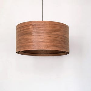 Wood pendant light made of walnut wood perfect for your bedroom or living room. The right choice of modern chandelier will give your space the aura you desire