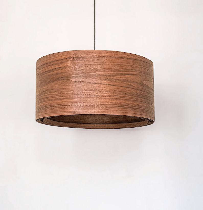Wood pendant light made of walnut wood perfect for your bedroom or living room. The right choice of modern chandelier will give your space the aura you desire
