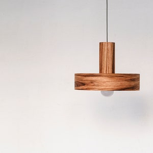 Modern ceiling light made of mango wood perfect for your kitchen or dining room. The right choice of wooden lampshade will give your space the aura you desire