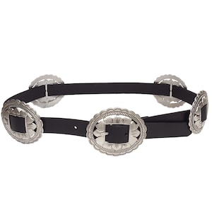 May include: Black belt with multiple silver-colored decorative buckles. The buckles have a floral design around a square center. The belt is made of a black material and has a classic western style.