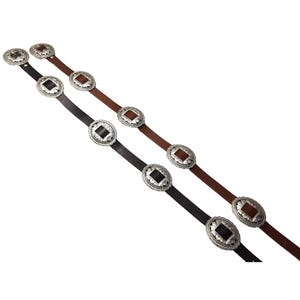 May include: Two leather belts with decorative silver-toned oval buckles. One belt is black, and the other is brown. The buckles have a square center design. The belts are displayed against a white background.