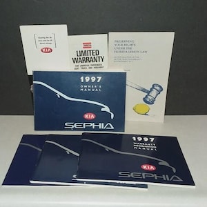May include: A selection of Kia Sephia car manuals and documents. The manuals include the 1997 Owner's Manual and Warranty Information Manual. Other documents include a Limited Warranty and a guide to the Florida Lemon Law.