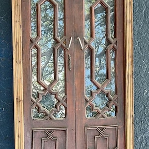 moroccan double door interior Mamounia vintage dark brown geometric  wooden artwork door with glass bedroom or living room
