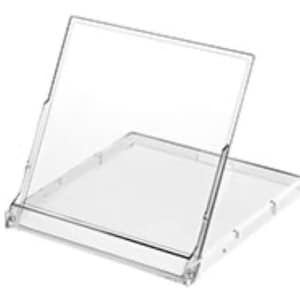 May include: A clear, hinged plastic display case, open and angled. The case has a rectangular base and a clear, upright cover. The design is simple and functional, with visible hinges and a transparent appearance.