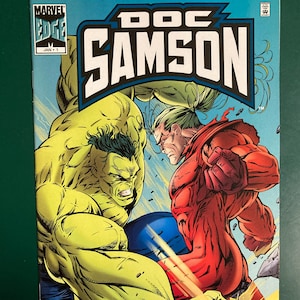 May include: A comic book cover featuring Doc Samson and the Hulk in a battle scene. The title "DOC SAMSON" is prominently displayed in bold, white letters against a blue background. The cover also includes the Marvel Edge logo and the text "JAN 1".