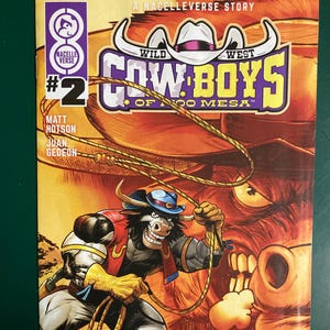 May include: Comic book cover for "Wild West Cowboys of Moo Mesa" #2. Features a cartoon bull cowboy with a rope, set against a fiery orange background. The cover includes the title, issue number, and creator names.