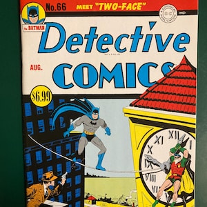 May include: Detective Comics No. 66 comic book featuring Batman and Robin. The cover shows Batman walking on a tightrope toward a clock tower where Robin is fighting. A man in a tan suit aims a gun from a building. The title is in blue and red text.