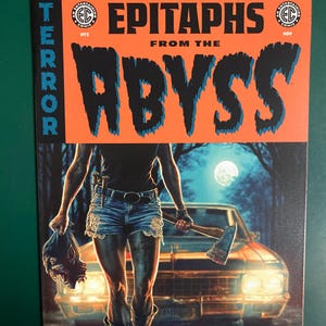 May include: Comic book cover with the title "Epitaphs From The Abyss" in large, stylized letters. The cover art features a figure holding an axe and a severed head, with a car in the background. The color scheme is orange, blue, and black.