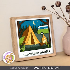 May include: A digital download of a camping scene with a tent, a camper van, a campfire, and the text "adventure awaits". The scene is in a paper cut style with a layered effect.