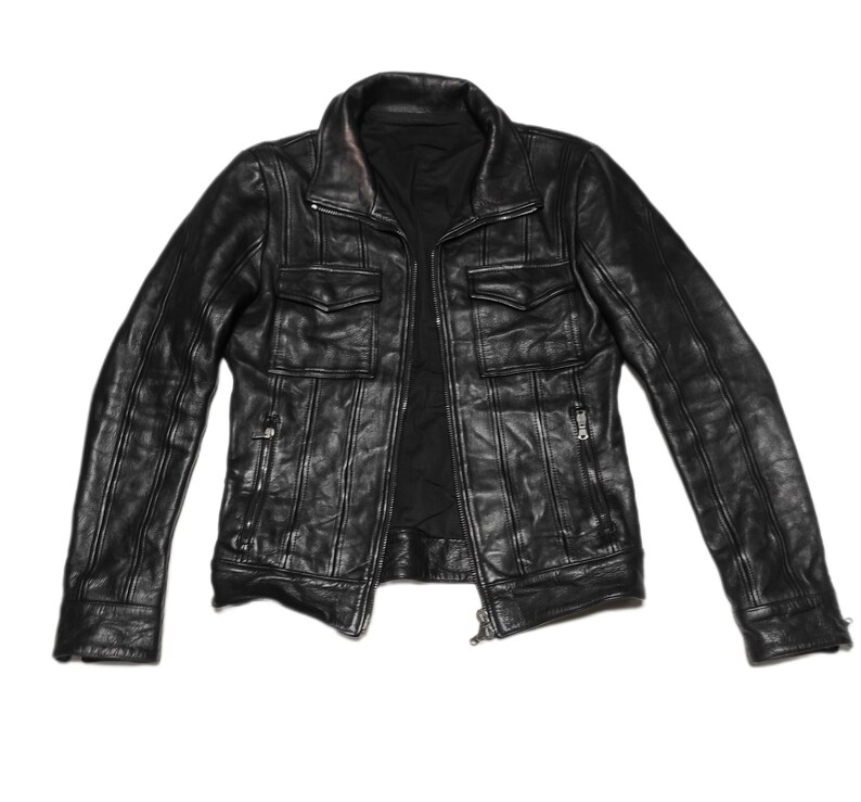 May include: A black leather jacket with a zipper closure and multiple pockets.