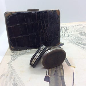 Portamonete sovrano in pelle antica e pochette antica