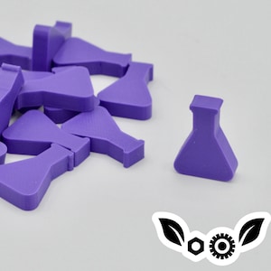 May include: A group of purple plastic beakers, some stacked on top of each other, with one beaker isolated in the foreground.