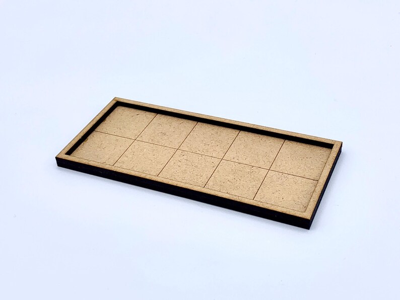 May include: A rectangular wooden tray with a grid pattern of ten squares. The tray has a dark brown border and a light brown interior. The item is set against a white background.