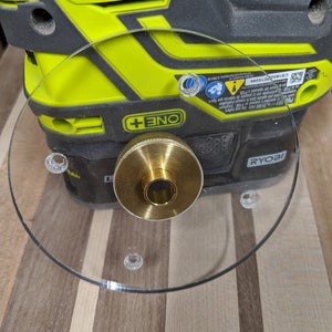 Ryobi (and Rigid) custom base plate to allow for guide bushings. Guides not included.