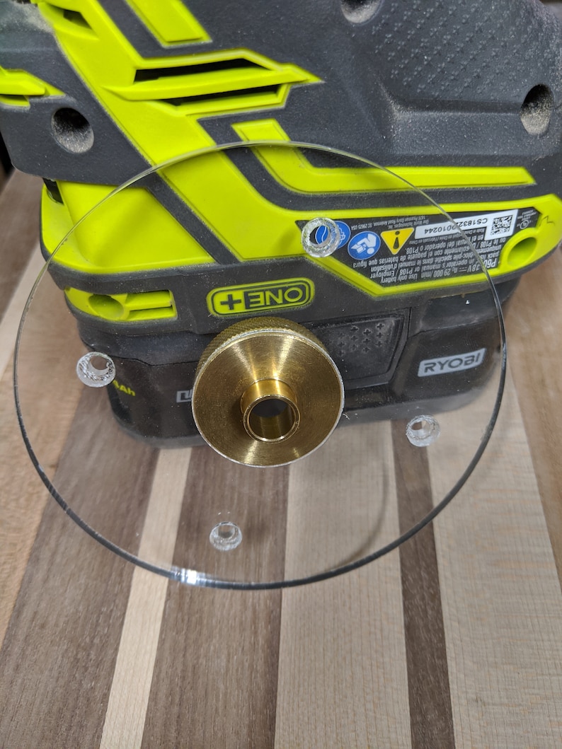 Ryobi (and Rigid) custom base plate to allow for guide bushings. Guides not included.