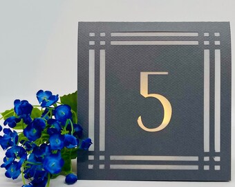 Modern Frame TABLE NUMBER Luminaries are made from card stock with the design cut out so your battery tea lights can shine through!