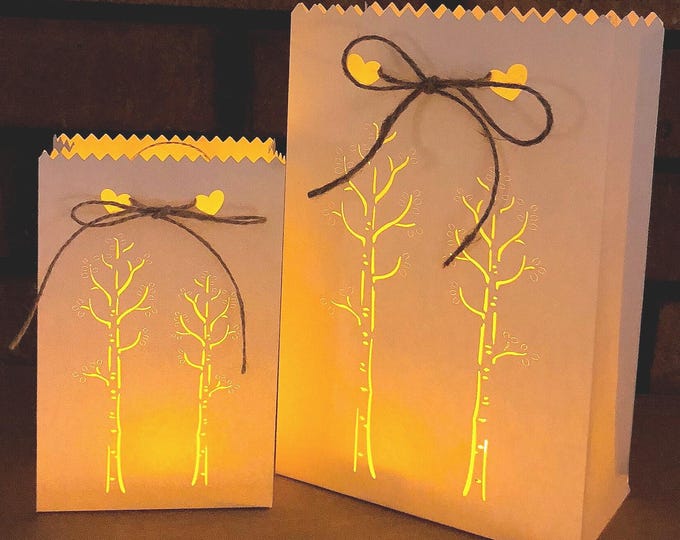 Aspen Luminary Bags with cut out Tree design. Fill with flowers for the table, or tie on to a chair or pew for lovely rustic wedding decor.